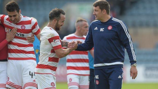 Martin Canning (right) celebrates at full-time