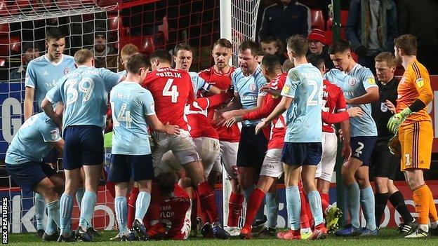 Charlton and Accrington players clash