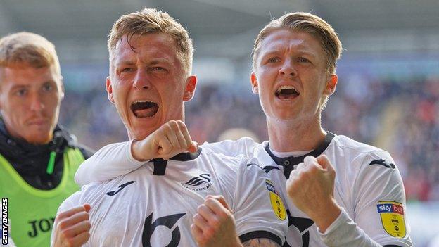 Ben Wilmot celebrates with George Byers