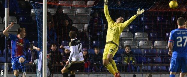 Carl Tremarco (left) scores Inverness' third goal