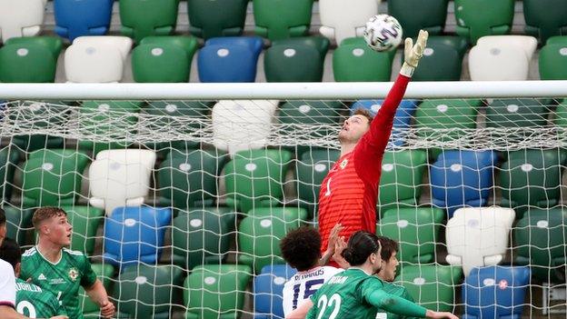 Conor Hazard leaps high for the ball against the USA at Windsor Park