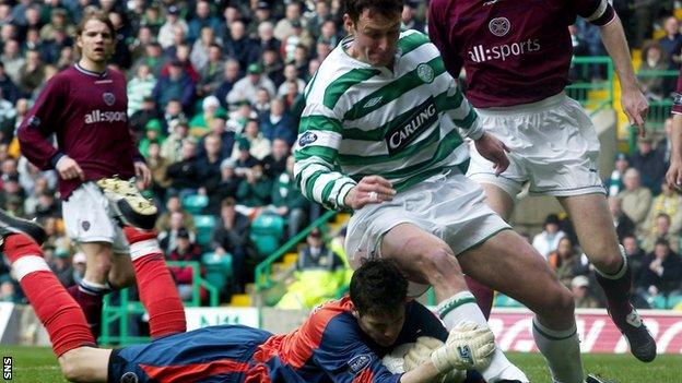 Hearts' Craig Gordon saves at the feet of Celtic's Chris Sutton