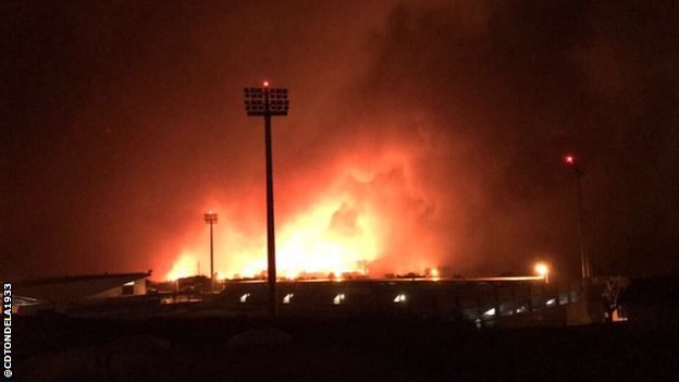 A photo showing fires approaching CD Tondela's stadium