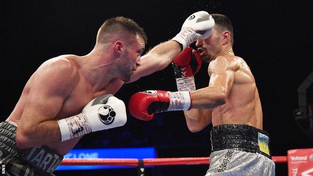 Josh Taylor unleashes a jab against Viktor Postol