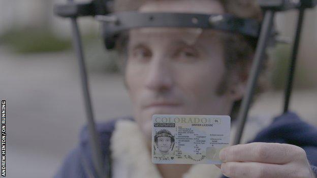 Tim Don shows his driving licence, which pictures him wearing the halo