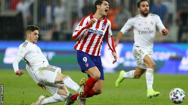 Federico Valverde tackles Alvaro Morata