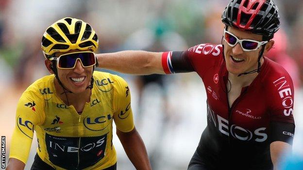 Egan Bernal and Geraint Thomas celebrate as they approach the finishing line at the end of Saturday's penultimate stage of the 2029 Tour de France