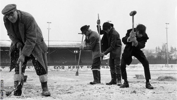 Workmen trying to crack the ice on the Gravesend and Northfleet pitch in preparation for an FA Cup tie with Sunderland in 1963