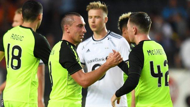 Scott Brown and Callum McGregor of Celtic embrace after eliminating Rosenborg from the Champions League