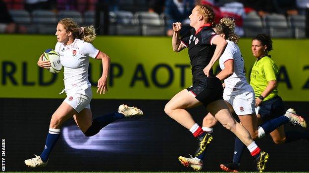 Abby Dow runs with the ball