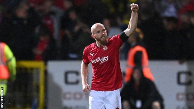 Jonny Williams celebrates scoring for Swindon