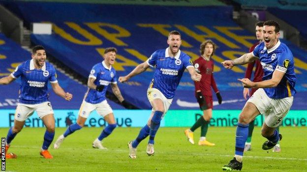 Lewis Dunk (right) celebrates scoring