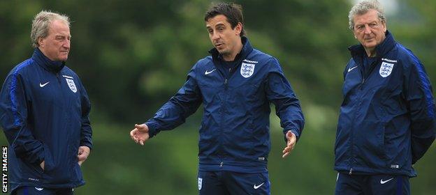 Roy Hodgson (right) stands with two members of his backroom staff in the form of Gary Neville (middle) and Ray Lewington (left)