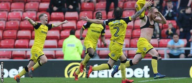 Burton celebrate their late goal to win it through Liam Boyce