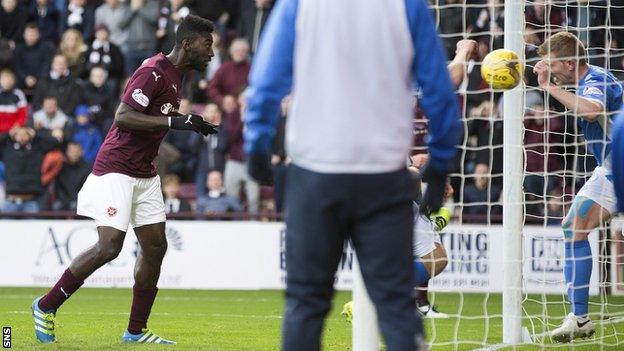 Prince Buaben heads home the opener for Hearts