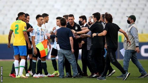 Officials stop play during Brazil v Argentina