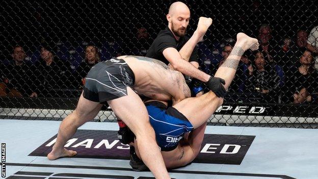 Paul Craig (grounded) submitted Nikita Krylov by triangle choke in the first round at UFC London