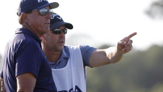 Phil Mickelson and his brother and caddie Tim