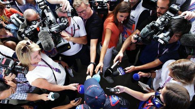 Scuderia Toro Rosso Naoki Yamamoto driver surrounded by journalists in a huddle