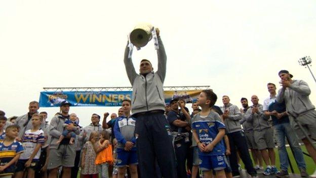 Leeds Rhinos parade the challenge cup in front of a home crowd