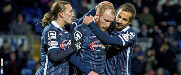 Liam Boyce (centre) is congratulated after netting a late penalty