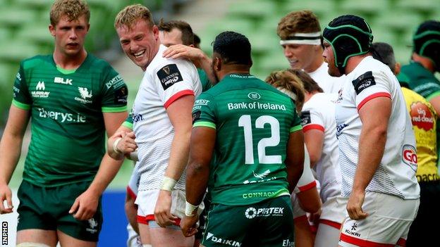 Ulster's Kieran Treadwell shares a joke with Connacht's Bundee Aki during the game at the Aviva Stadium in August