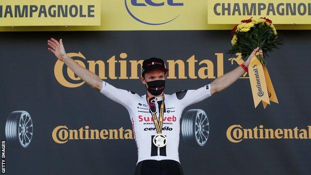 Sunweb's Soren Kragh Andersen celebrates on the podium after winning stage 19 of the 2020 Tour de France