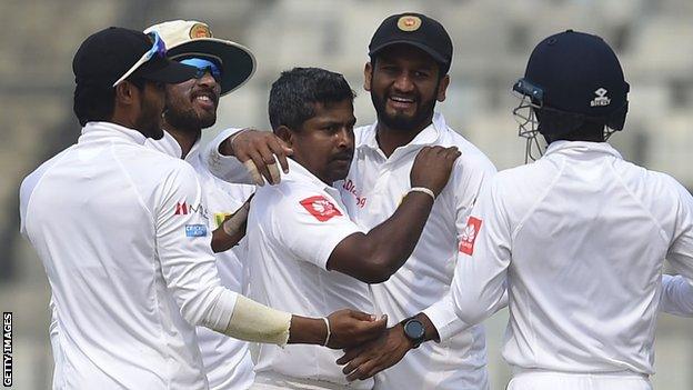 Rangana Herath (centre) celebrates a wicket