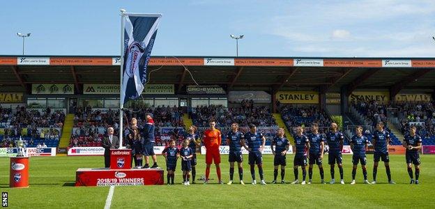 Ross County unfurl the Scottish Championship flag