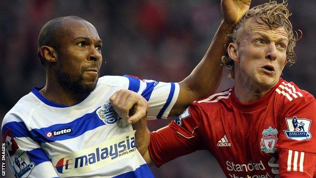 Danny Gabbidon (left) challenges Dirk Kuyt