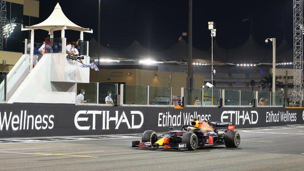 Max Verstappen takes the chequered flag