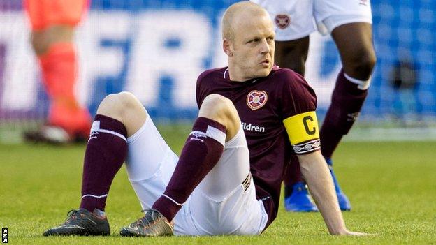 Steven Naismith looks dejected as he awaits treatment on the pitch