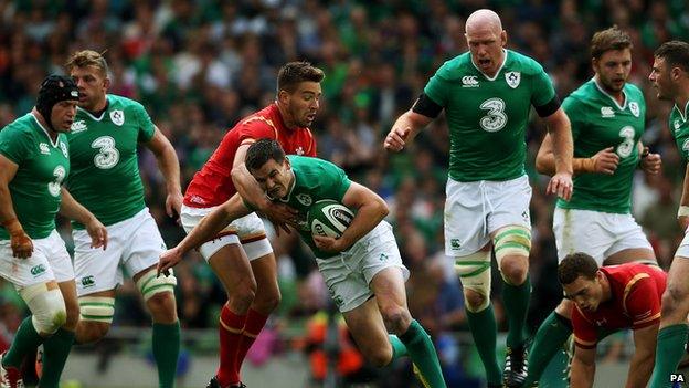 Ireland's Jonny Sexton tackled by Wales' Rhys Webb during the World Cup Warm Up Match