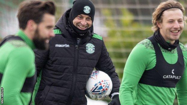 A well wrapped up Jack Ross keeps an eye on Hibs training on Thursday