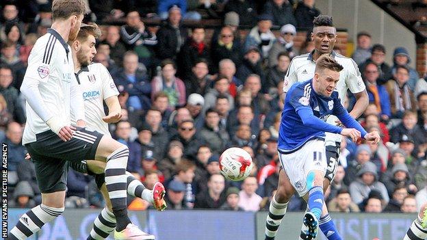 Craig Noone has a shot on goal against Fulham