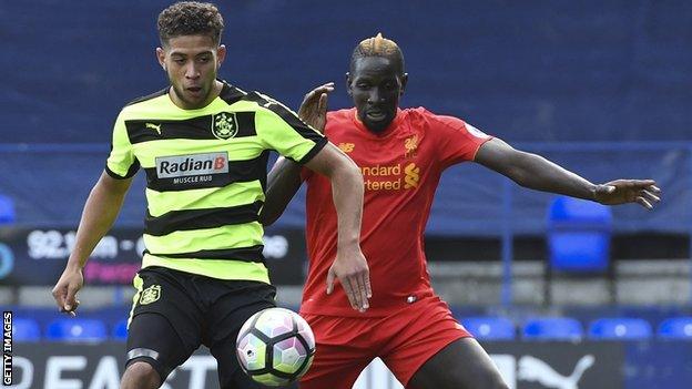 Rekeil Pyke in action for Huddersfield Town against Mamadou Sakho of Liverpool in the Premier League Cup