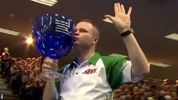 Paul Foster kisses his trophy