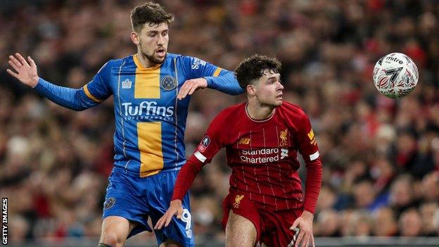 Neco Williams in action against Shrewsbury Town's Callum Lang