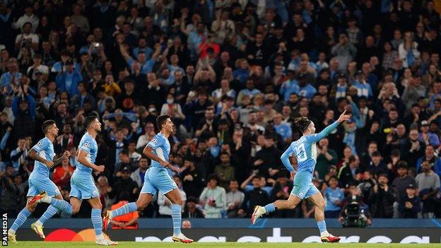 Jack Grealish celebrates scoring Manchester City's fourth goal against RB Leipzig