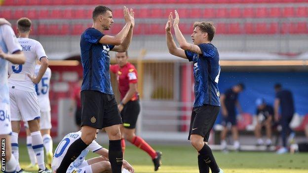 Edin Dzeko and Nicolo Barella