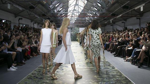 Models wear outfits by designer Jasper Conran, during the spring/summer 2016 show for London Fashion Week at Brewer Street Car Park, in Soho