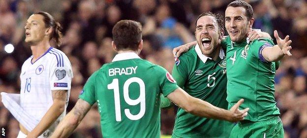 Robbie Brady, Richard Keogh and John O'Shea celebrate the Republic of Ireland reaching Euro 2016