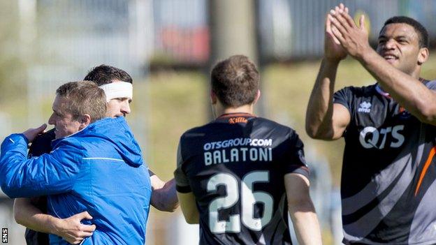 Kilmarnock manager Lee Clark congratulates his players