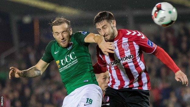 Karl Sheppard and Aaron Barry in action at Turner's Cross