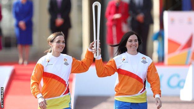 Victoria Pendleton and Anna Meares carry the baton at the launch of the Queen"s Baton Relay