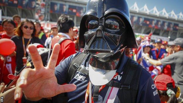 A fan at the Japanese Grand Prix dresses up as Darth Vader