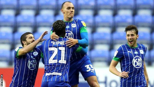 Wigan celebrate a goal