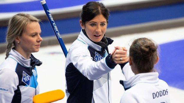 Scotland skip Eve Muirhead shakes hands with team-mate Jen Dodds