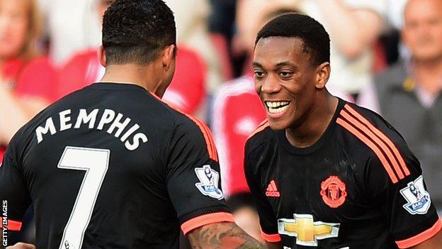 Anthony Martial celebrates with Memphis Depay