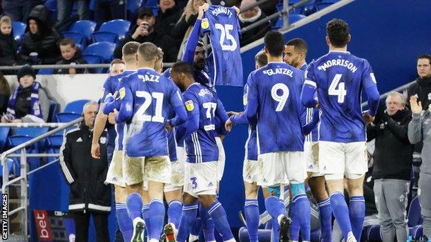 Goalscorer Callum Paterson holds up a shirt in tribute to non-league footballer Jordan Sinnott, who died last Saturday